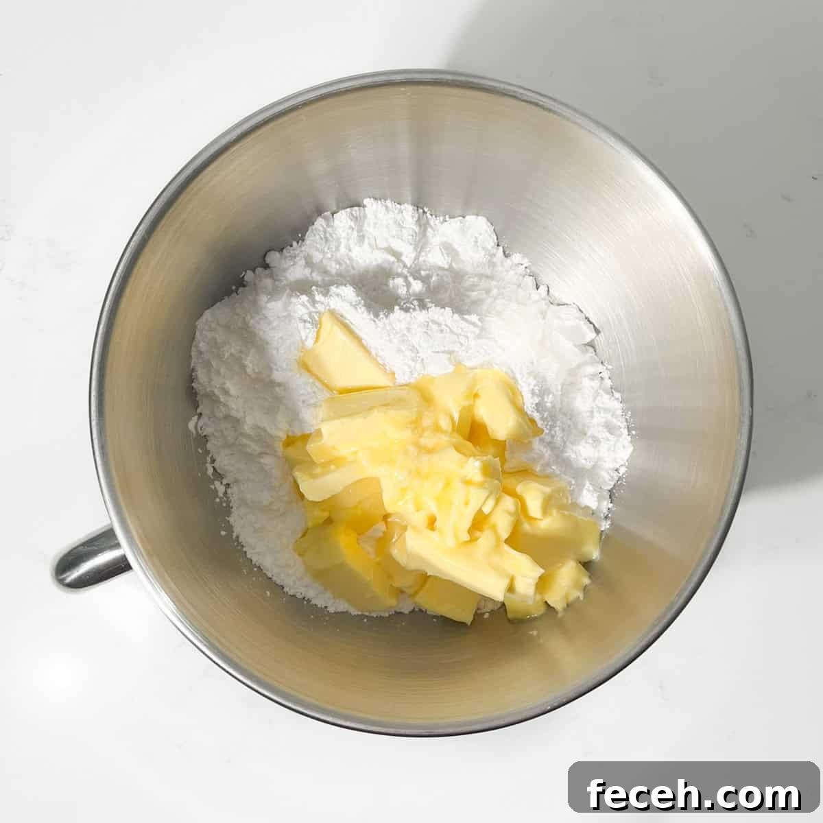 Icing and butter in a large bowl.