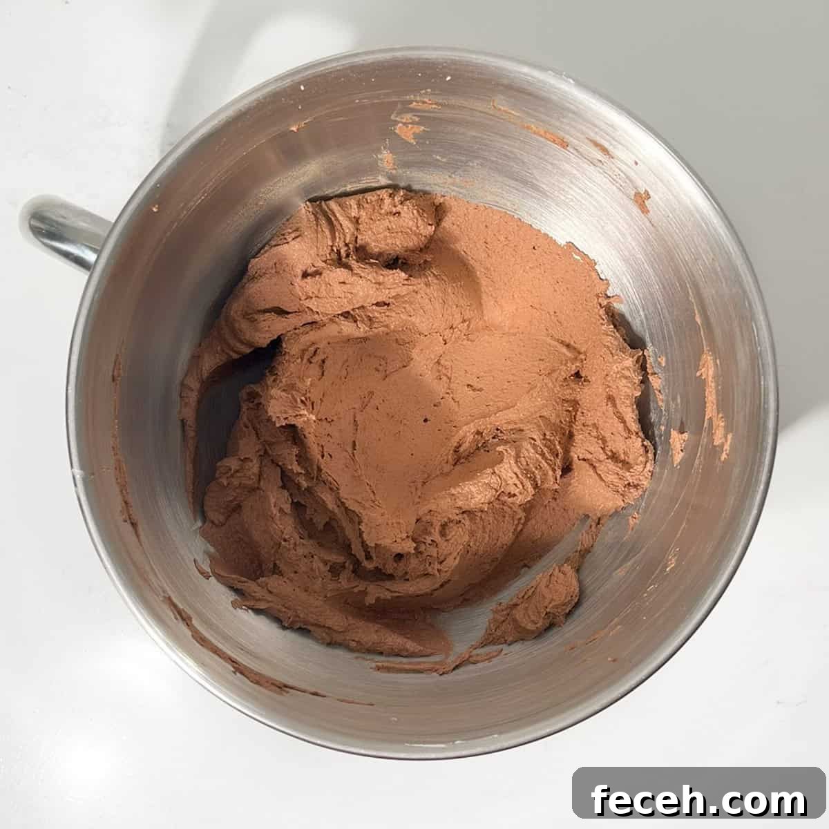 Chocolate orange buttercream in a large bowl.