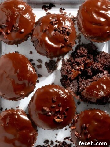 Triple chocolate muffins on a white tray.