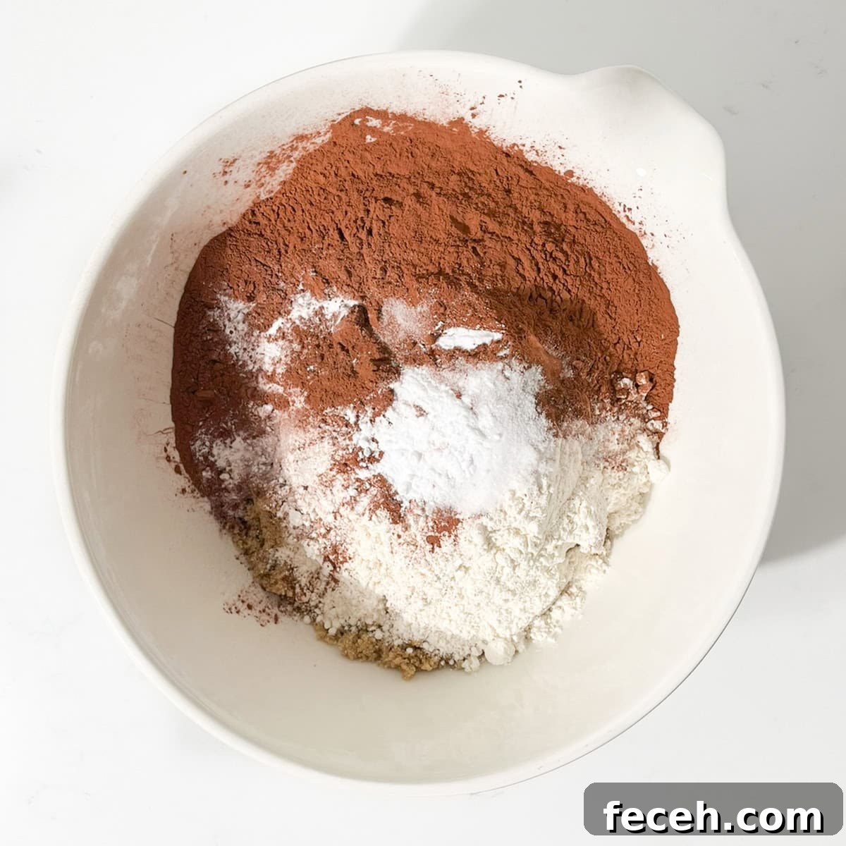 Dry ingredients in a large white bowl.
