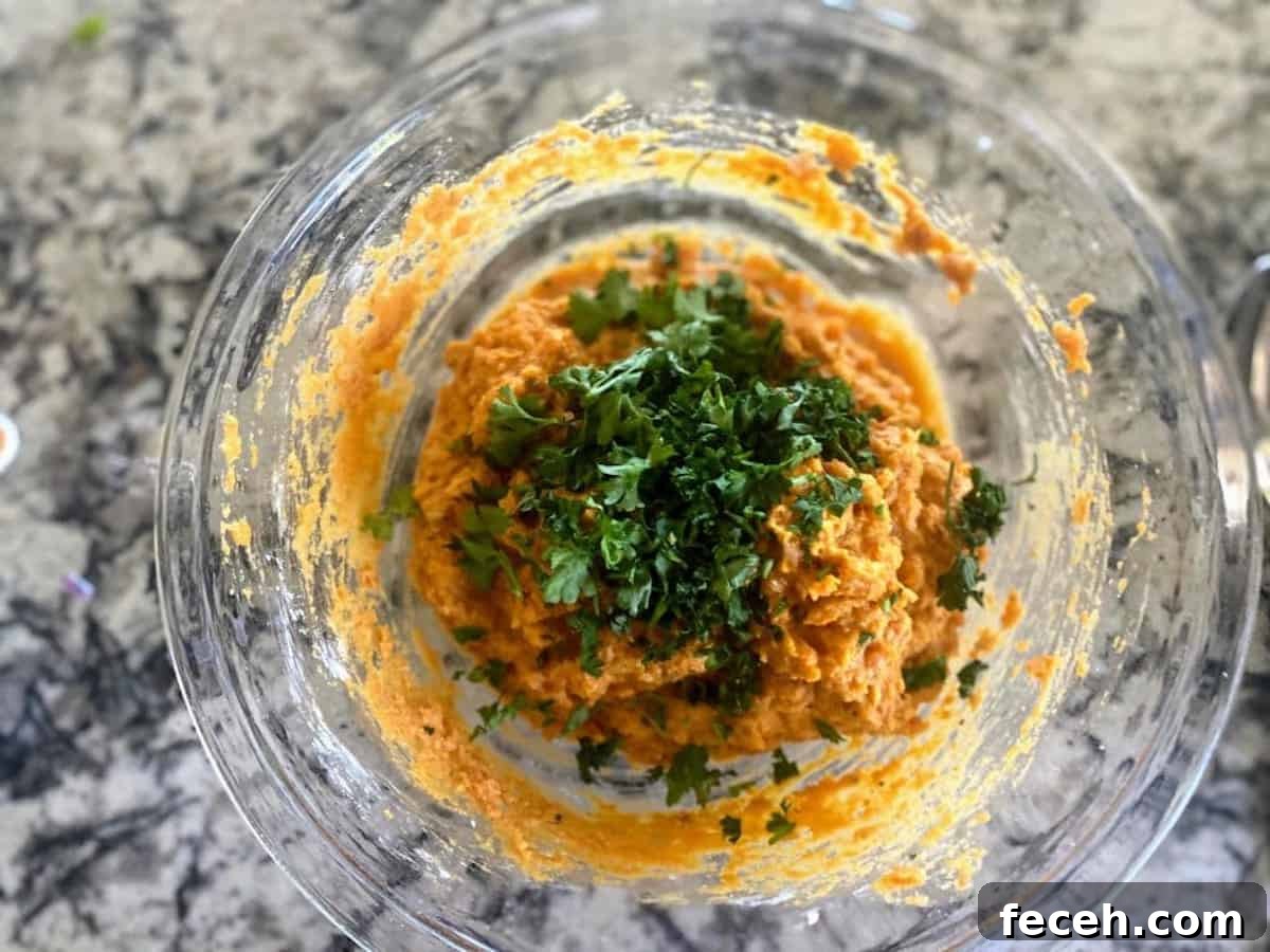 Sweet potato mixture in a bowl with parsley