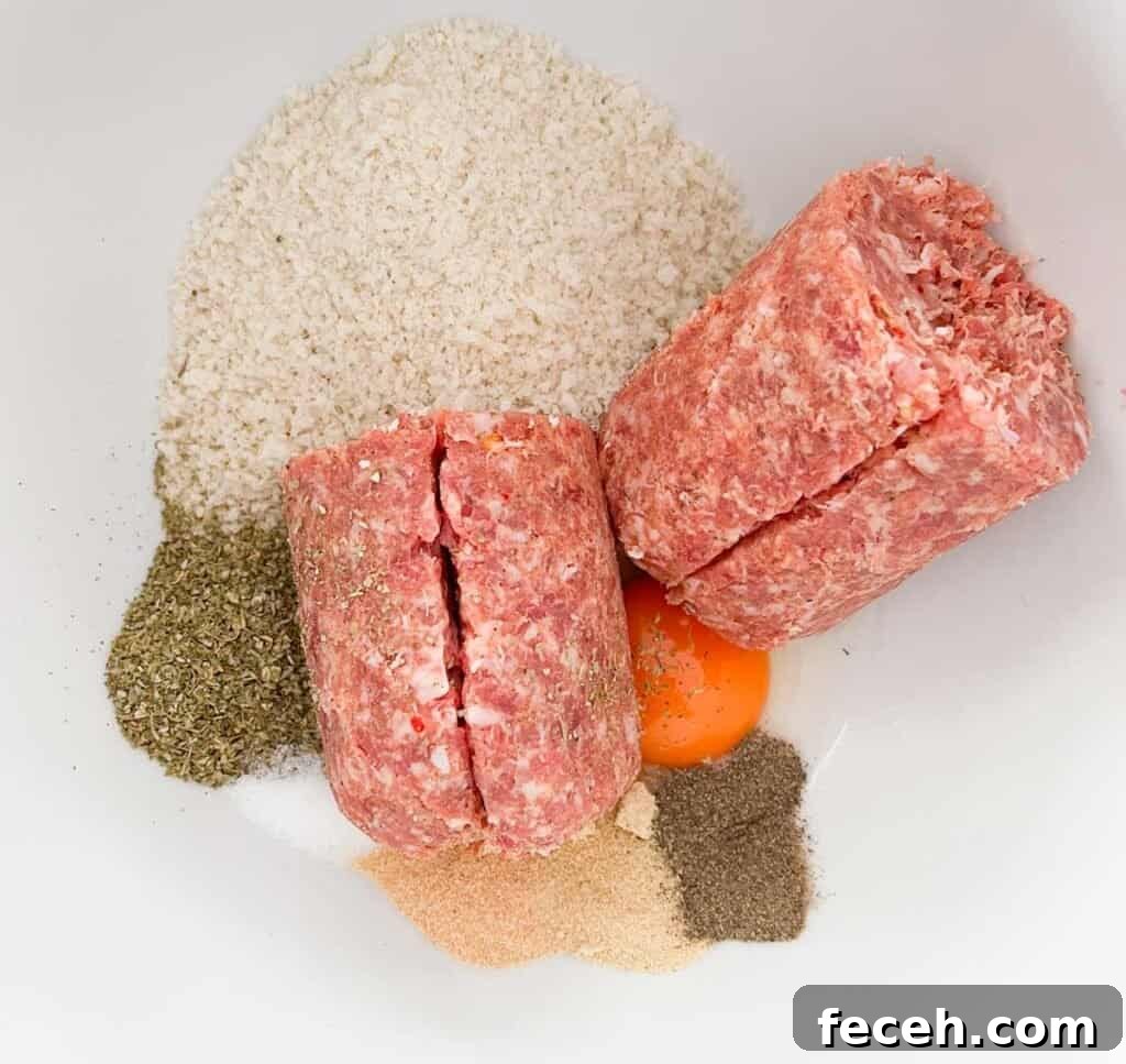 sausage roll filling ingredients in white bowl before mixing