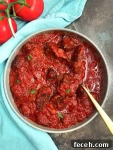 15 Global Soups and Hearty Stews to Warm Any Night 11 Nigerian Beef Stew in a bowl with a spoon.