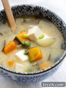 15 Global Soups and Hearty Stews to Warm Any Night 15 A bowl of miso soup with chicken and tofu.