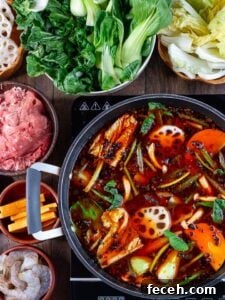 15 Global Soups and Hearty Stews to Warm Any Night 16 A pot with Japanese soup with vegetables, beef, and noodles.