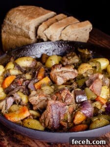 15 Global Soups and Hearty Stews to Warm Any Night 4 Peka stew with meat and vegetables in a skillet with bread.