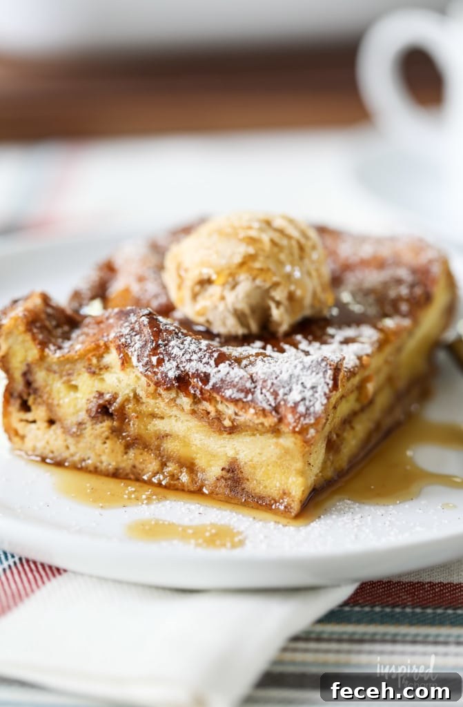 unclose photo of pumpkin french toast casserole served with butter and maple syrup.