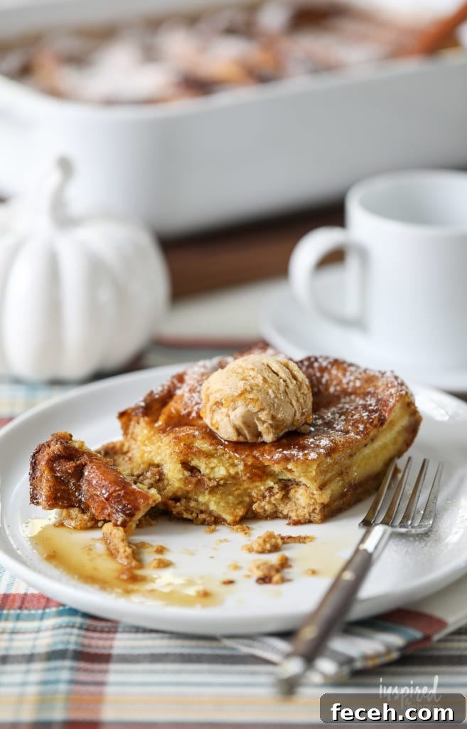 piece of pumpkin french toast casserole on a plate with a bite removed.