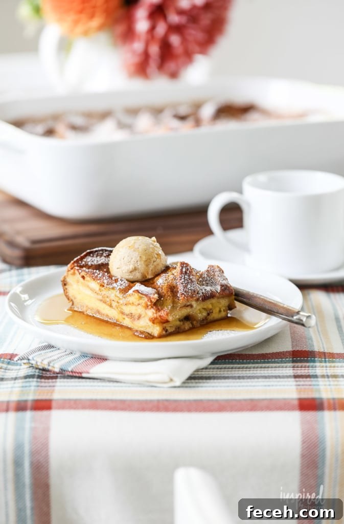 slice of pumpkin french toast casserole on a plate with a fork.