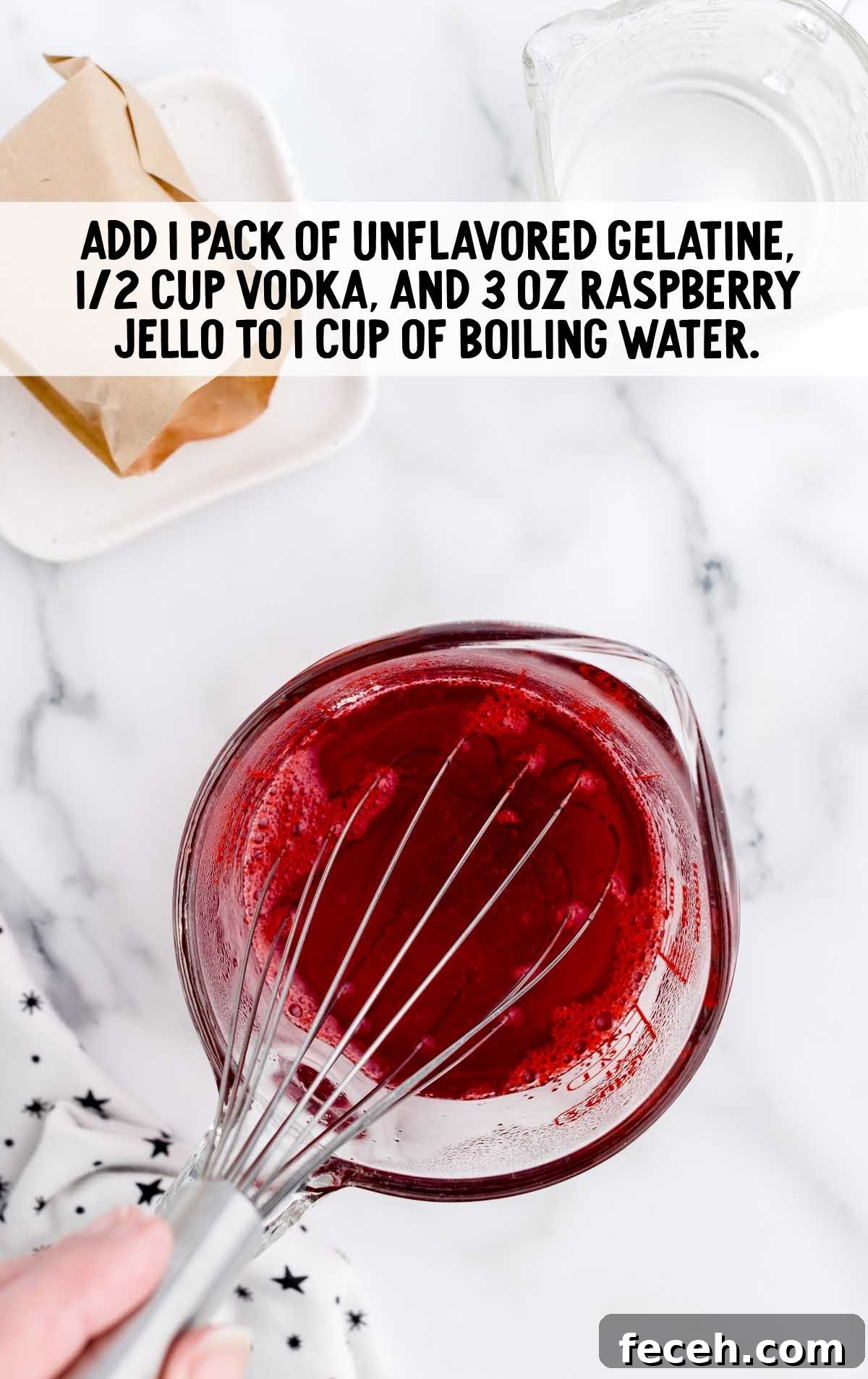 unflavored gelatin, vodka, raspberry jello and boiling water whisked in a measuring cup