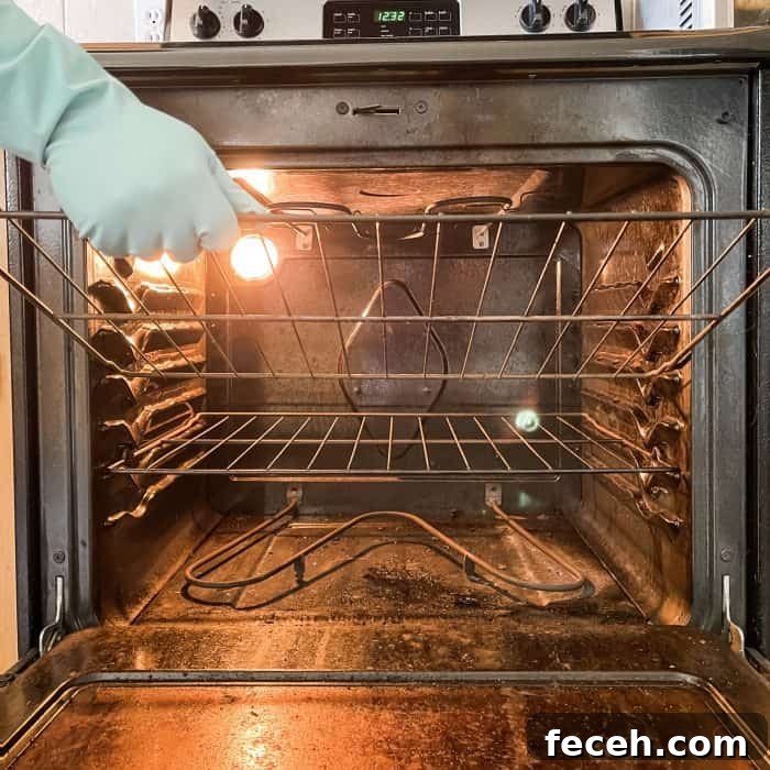 removing oven racks in prep for cleaning oven