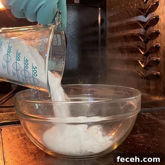 adding baking soda to bowl to make homemade oven cleaner