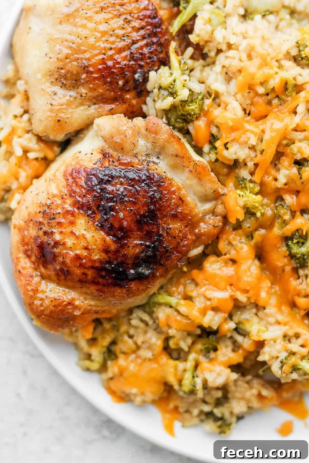 Cheesy chicken broccoli and rice on a plate.