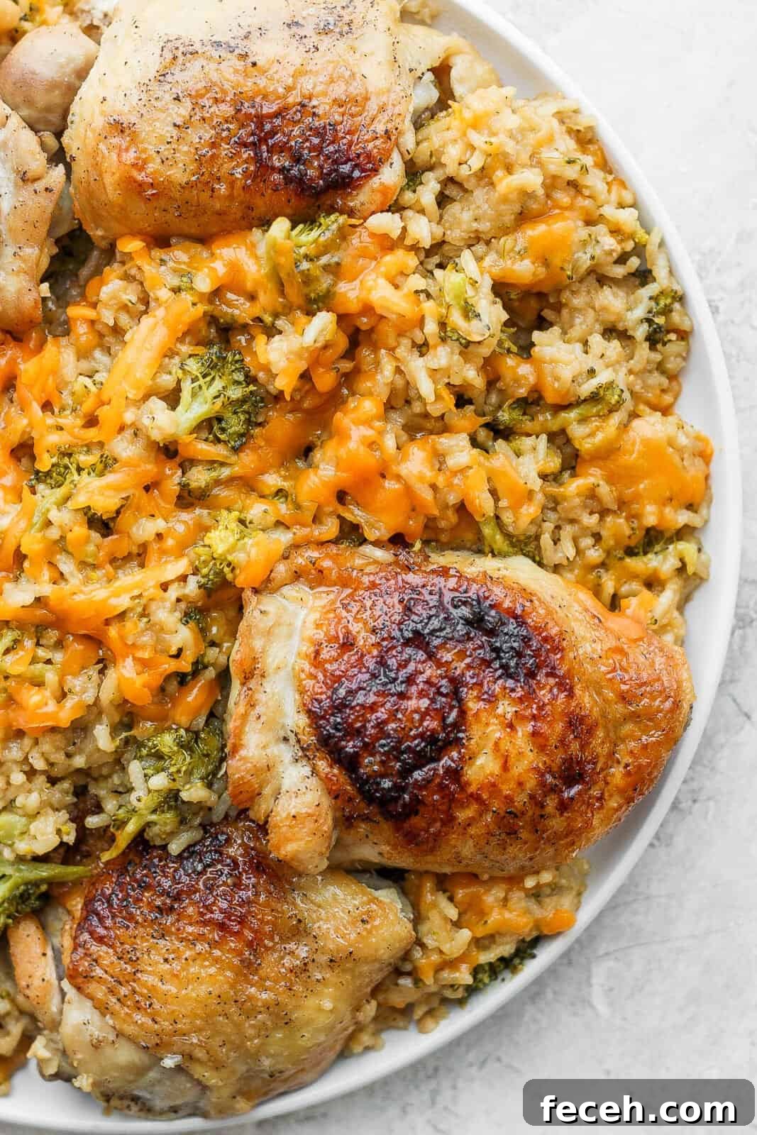 Cheesy chicken broccoli and rice on a plate.