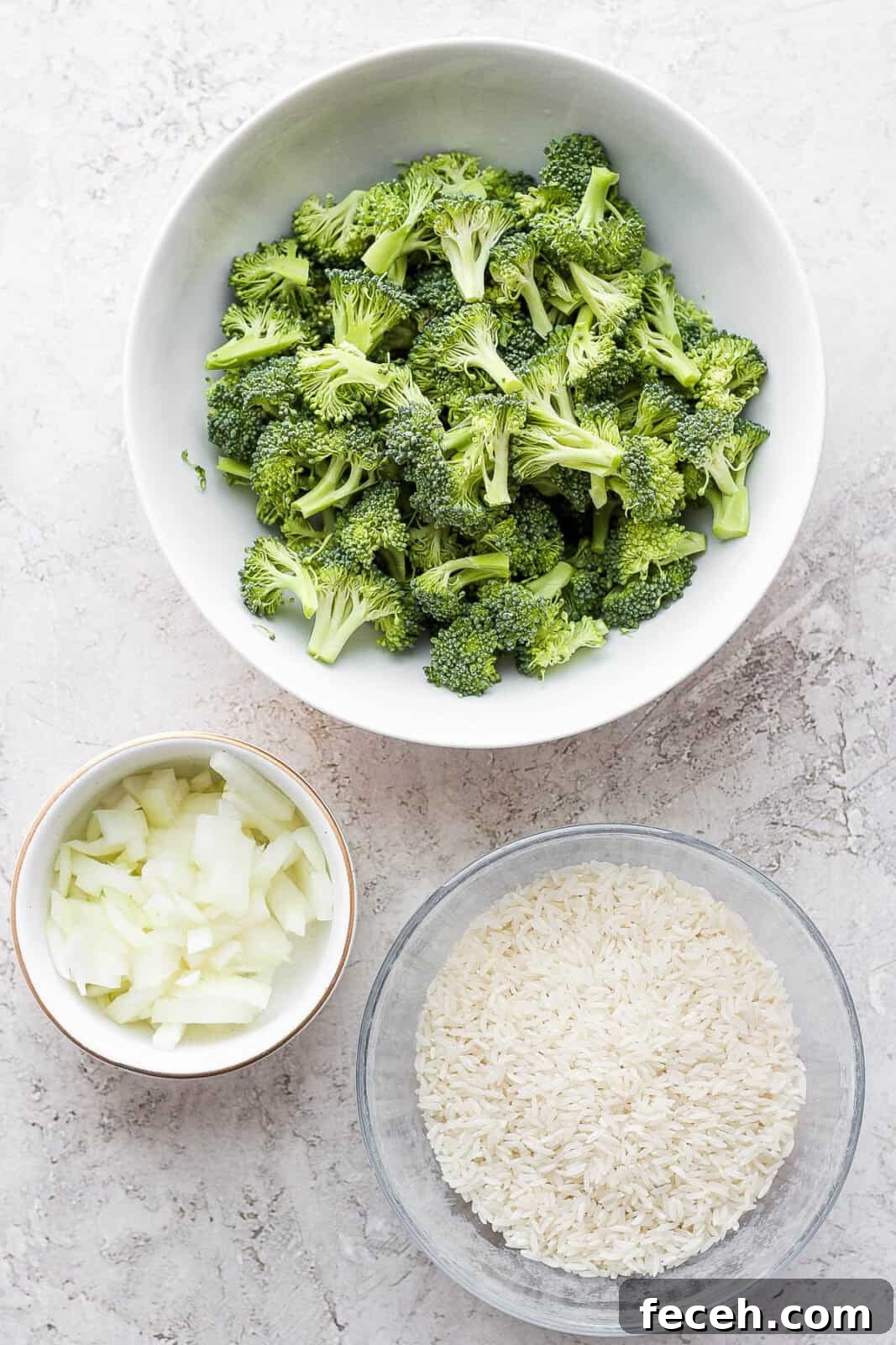 Bowls with broccoli, onion, and rice.