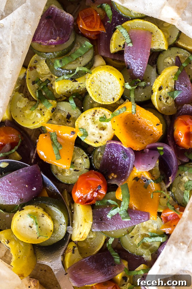 Oven Roasted Summer Vegetables in parchment paper roasting bag topped with fresh herbs