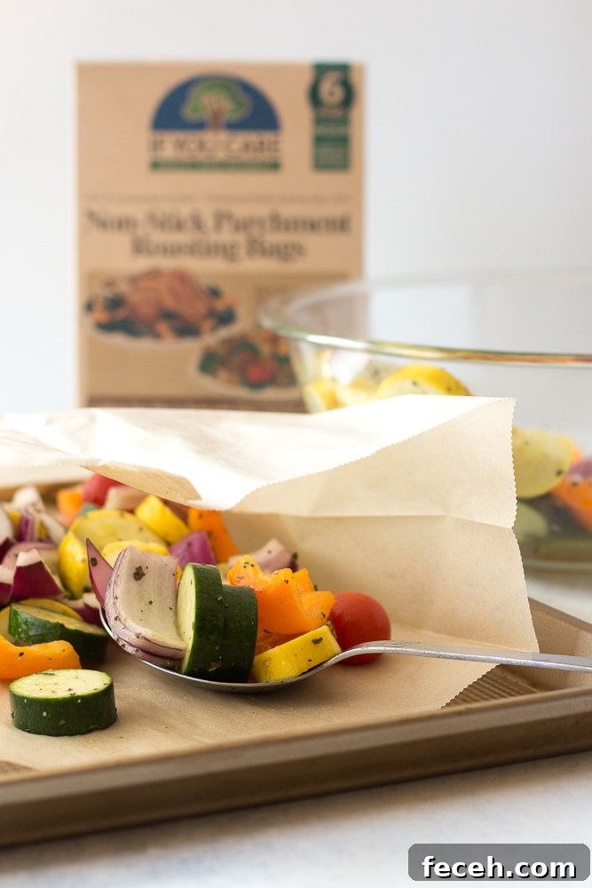 spooning vegetables on parchment lined baking sheet