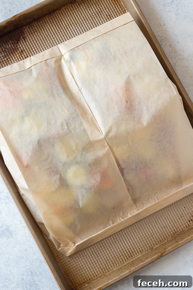 Oven Roasted Summer Vegetables in parchment paper roasting bag on baking dish