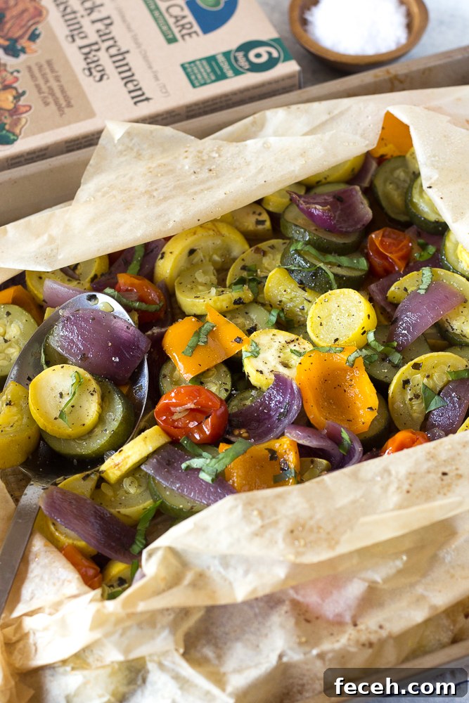 Oven Roasted Summer Vegetables in parchment paper roasting bag topped with fresh herbs