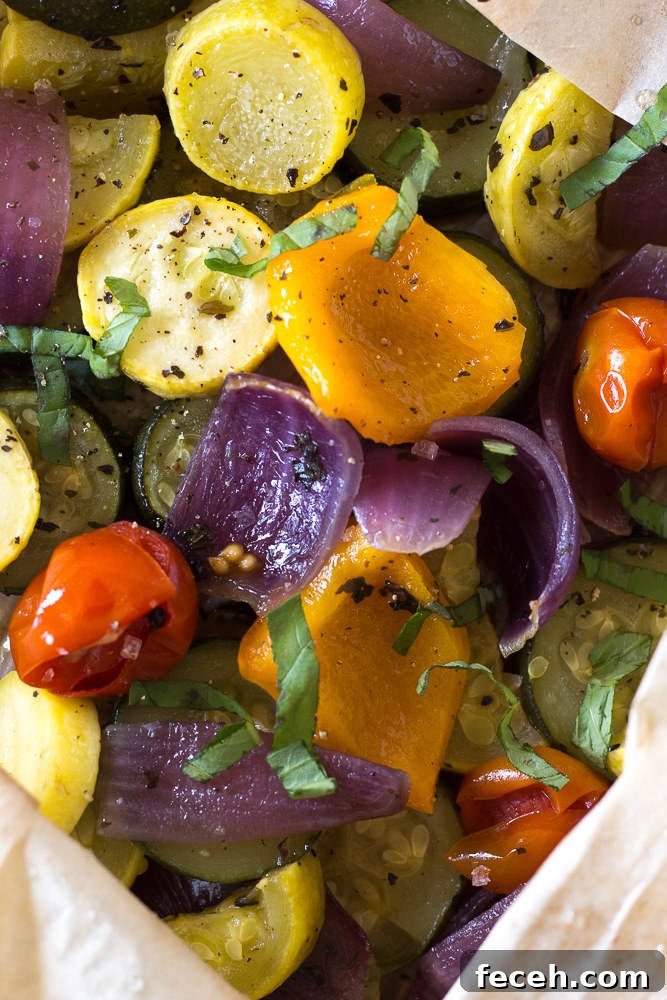 Oven Roasted Summer Vegetables in parchment paper roasting bag topped with fresh herbs