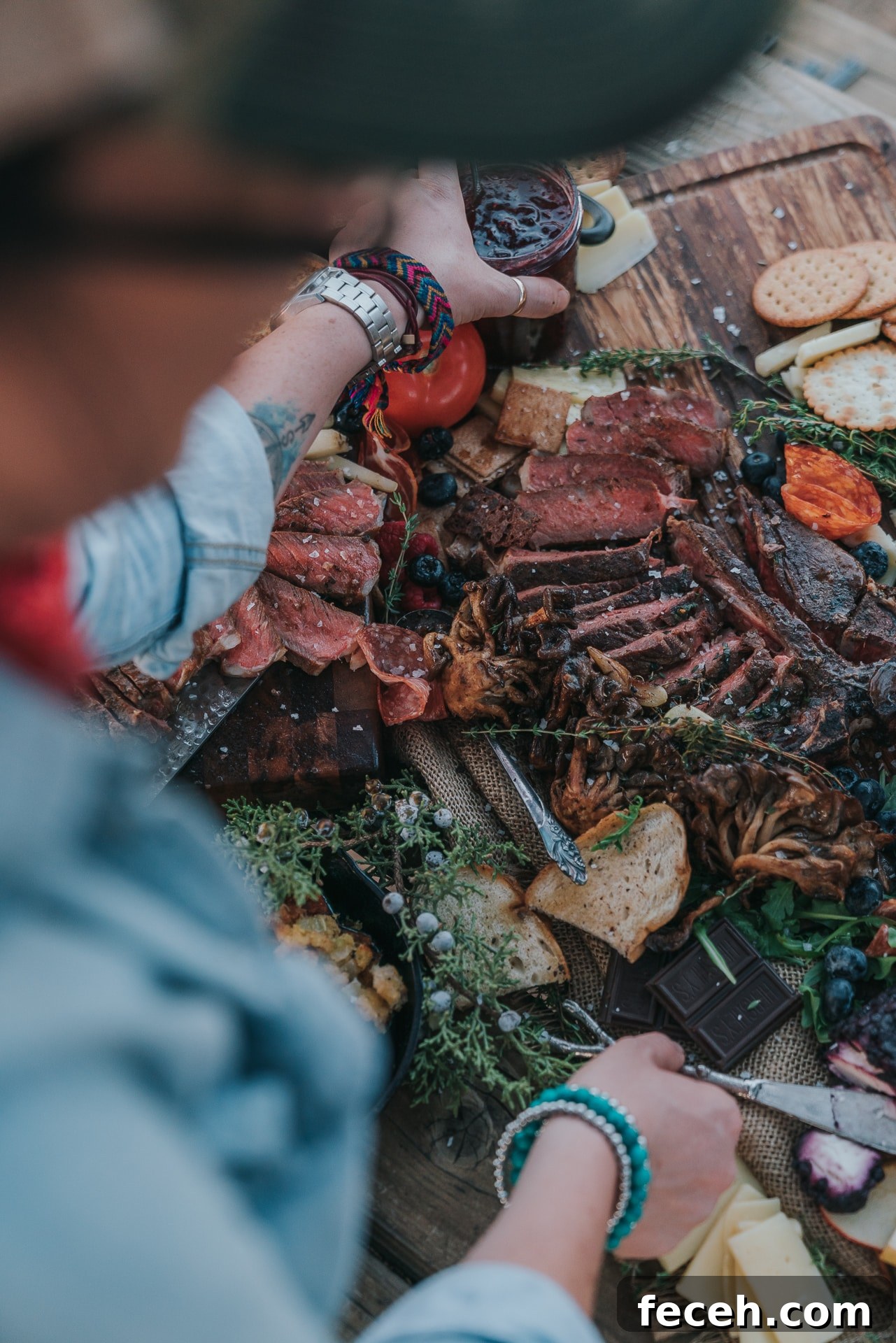 Woman assembling charcuterie board.