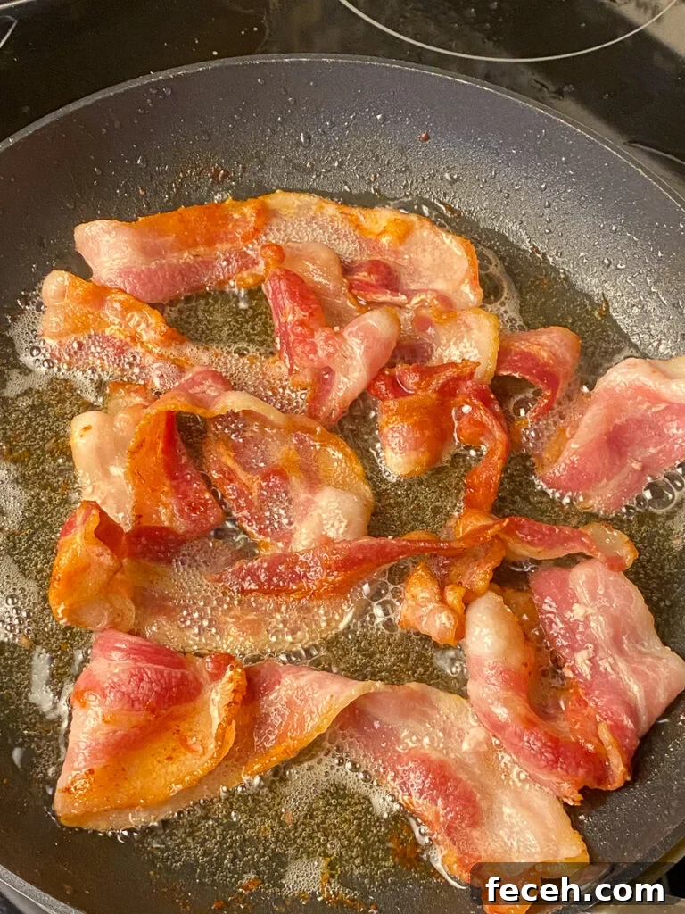 Spinach Salad with Bacon, Mushrooms, and Warm Balsamic Dressing 6 Bacon frying in a skillet
