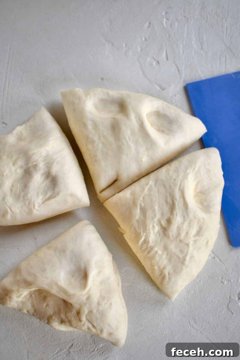 Soft Homemade Pretzel Bites Recipe for Perfect Party Snacks 9 cutting the proved dough into 4 pieces before rolling out and cutting.