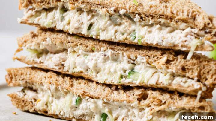 Close up of a stack of Chicken Sandwiches on a plate.