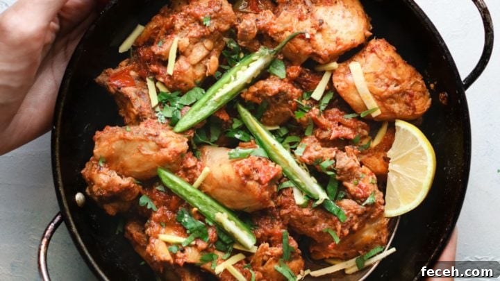 Holding Chicken Karahi in a karahi
