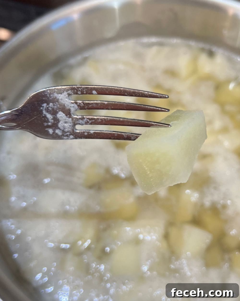 pierce boiled potatoes with fork.