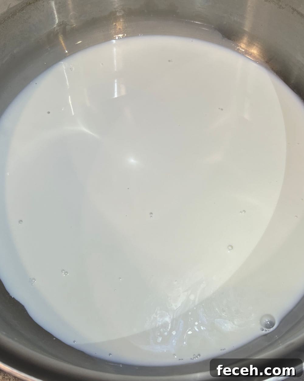 warm up half and half in pot.