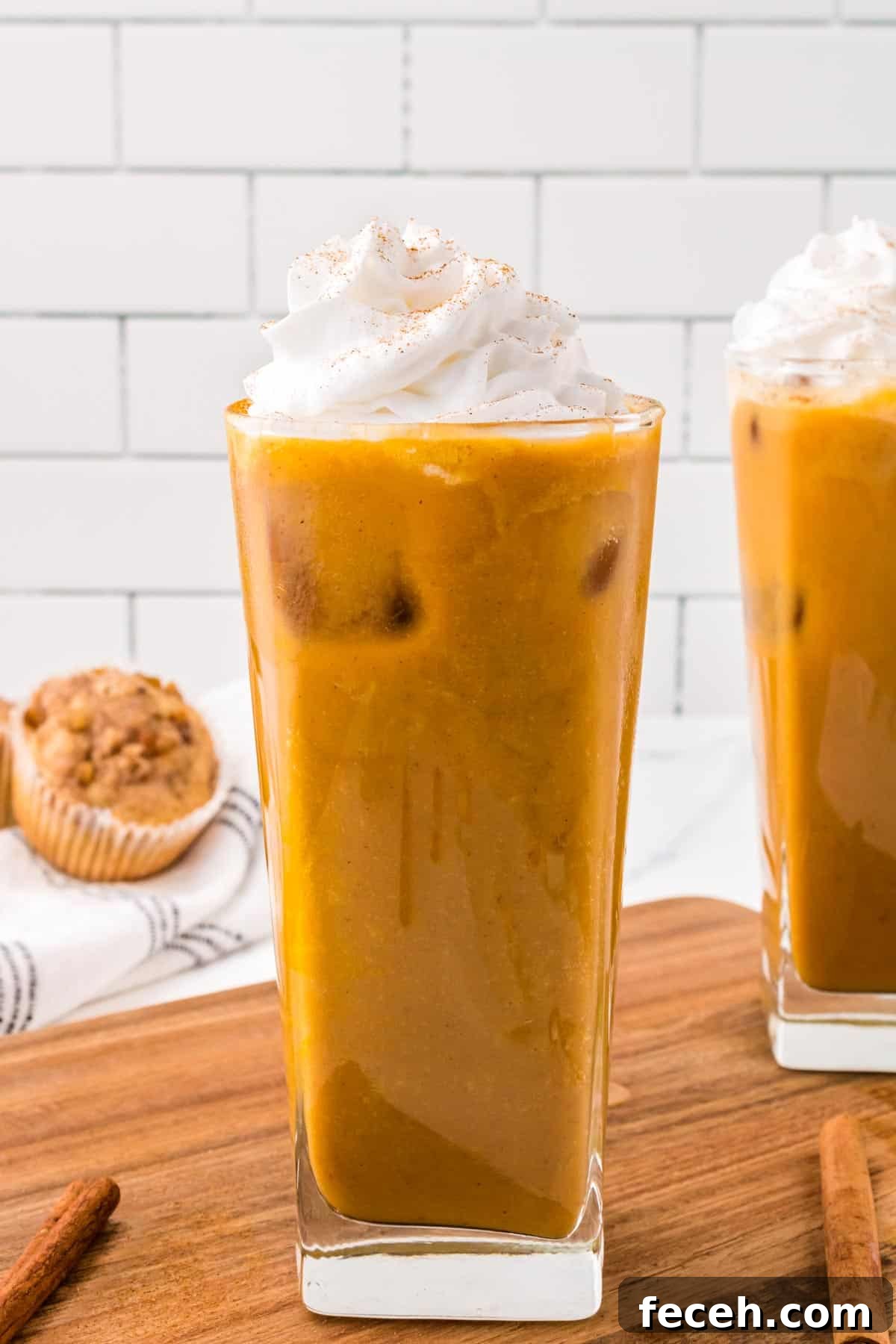 Whipped topping on top of a pumpkin latte.