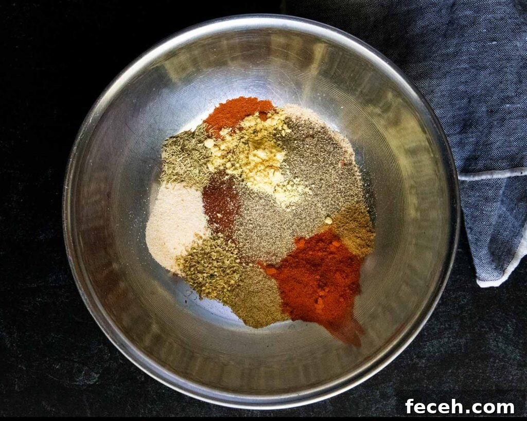 Smoked Double Bone-In Pork Chops with Bold Smoky Flavor 6 Various herbs and spices in a mixing bowl.