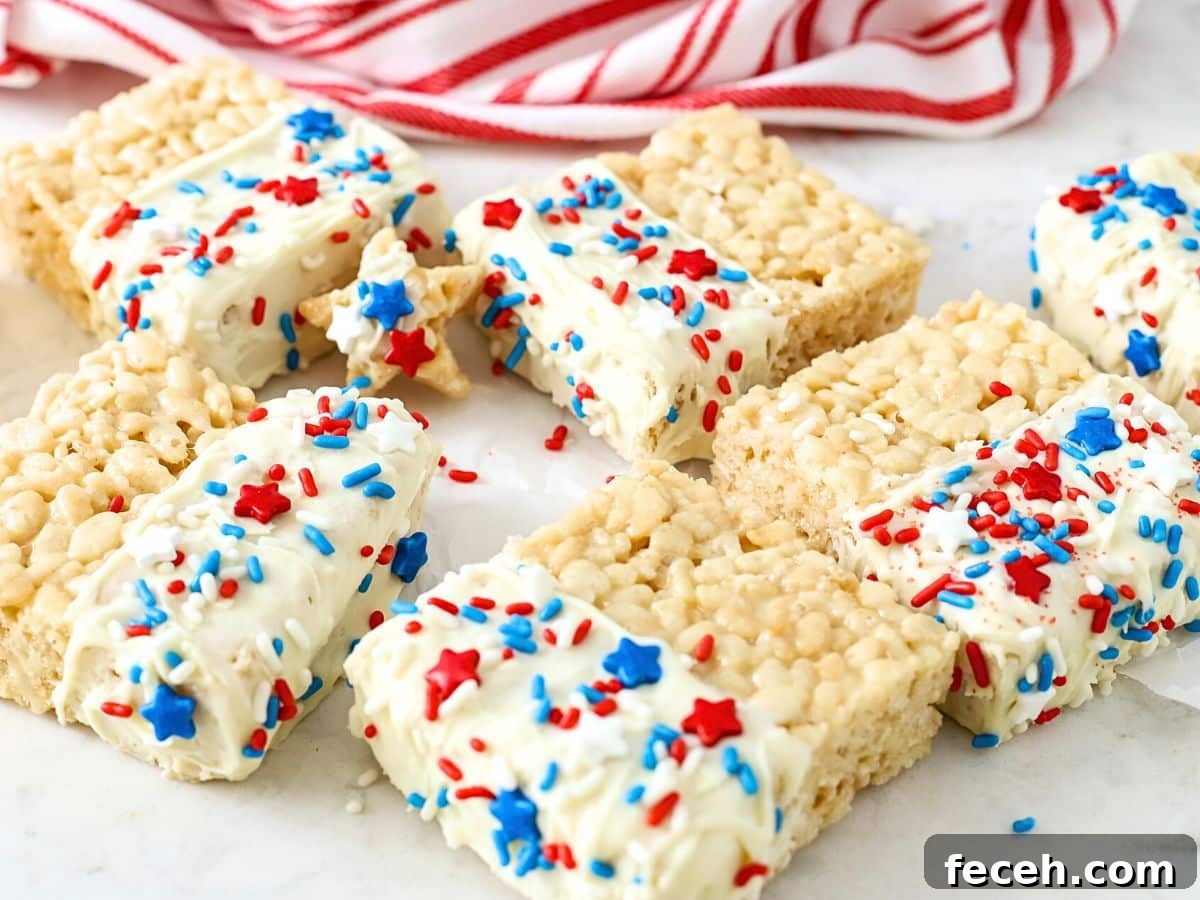 Fourth of July Rice Krispie Treats: Patriotic Red, White & Blue Recipe 7 Fourth of July Rice Krispie Treats on a counter.