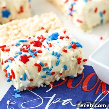 Fourth of July Rice Krispie Treats: Patriotic Red, White & Blue Recipe 9 A rice krispie marshmallow treat on a napkin.