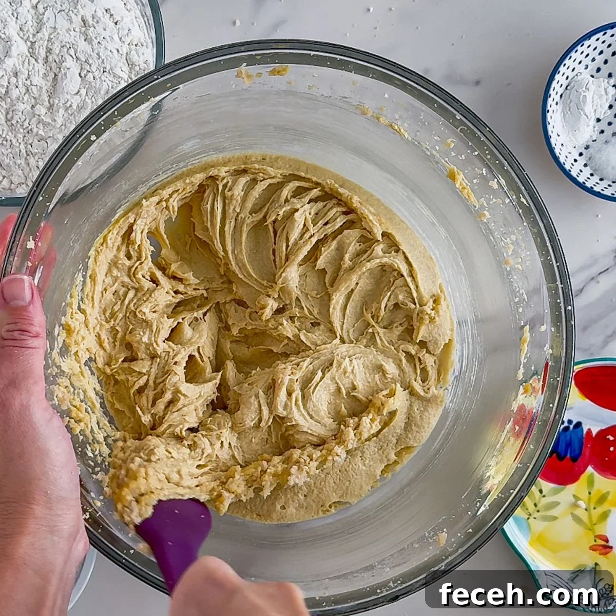 Adding the flour and folding it in.