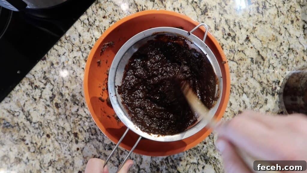 Instant Pot Birria Quesabirria Tacos Recipe 23 Pour the chili purée into the strainer (we do this so the skins stay behind). Use a mixing spoon or spatula to press and swirl around so the purée seeps through the strainer...