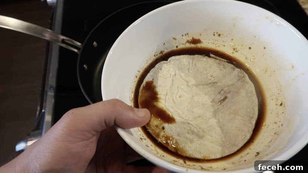 Instant Pot Birria Quesabirria Tacos Recipe 25 Now to make the tacos! Briefly soak corn tortillas in the large bowl of reserved consommé...