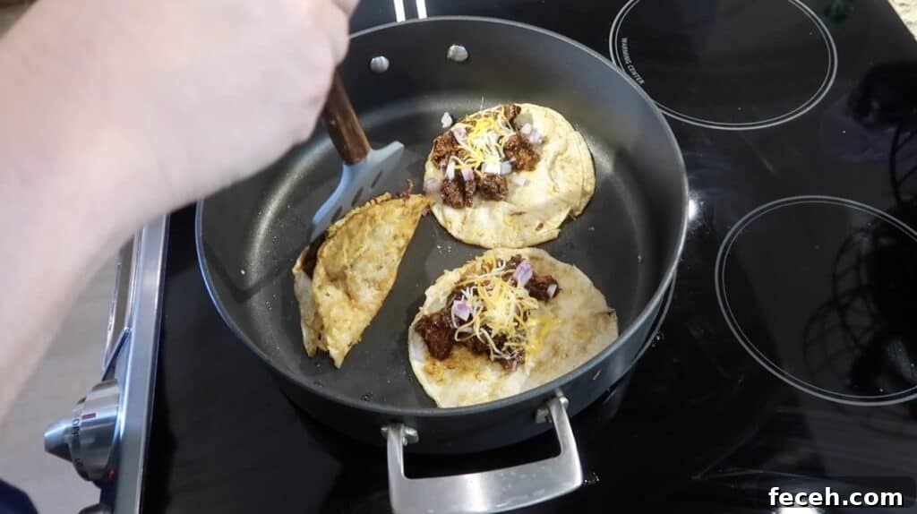 Instant Pot Birria Quesabirria Tacos Recipe 27 After a minute or two, use a spatula to check on the tortillas. Once they're getting crispy, flip into a taco-like position and cook on each side for about 30-60 seconds more.