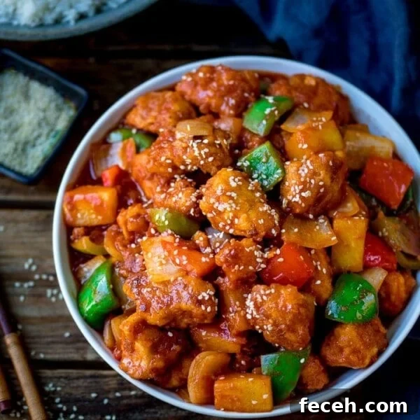 Sweet and sour chicken in a white bowl