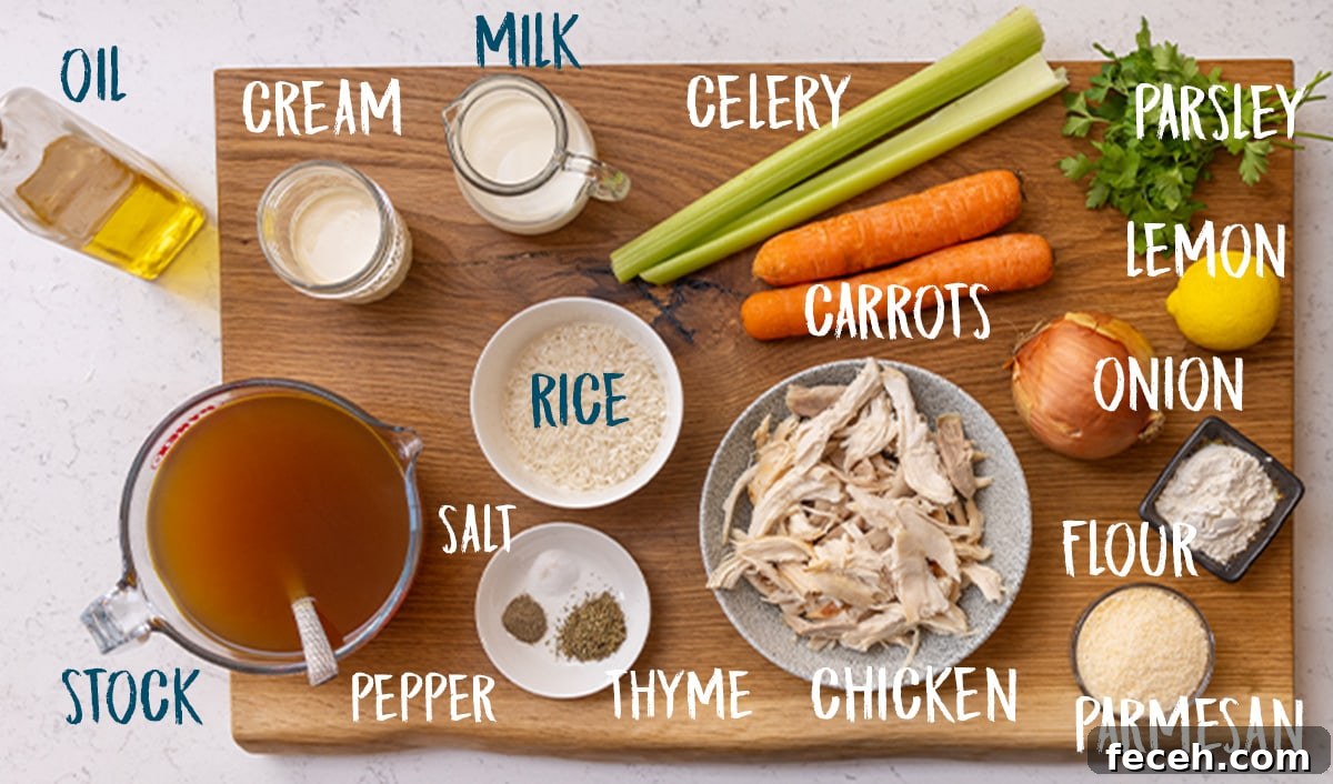 Ingredients for chicken and rice soup on a wooden board