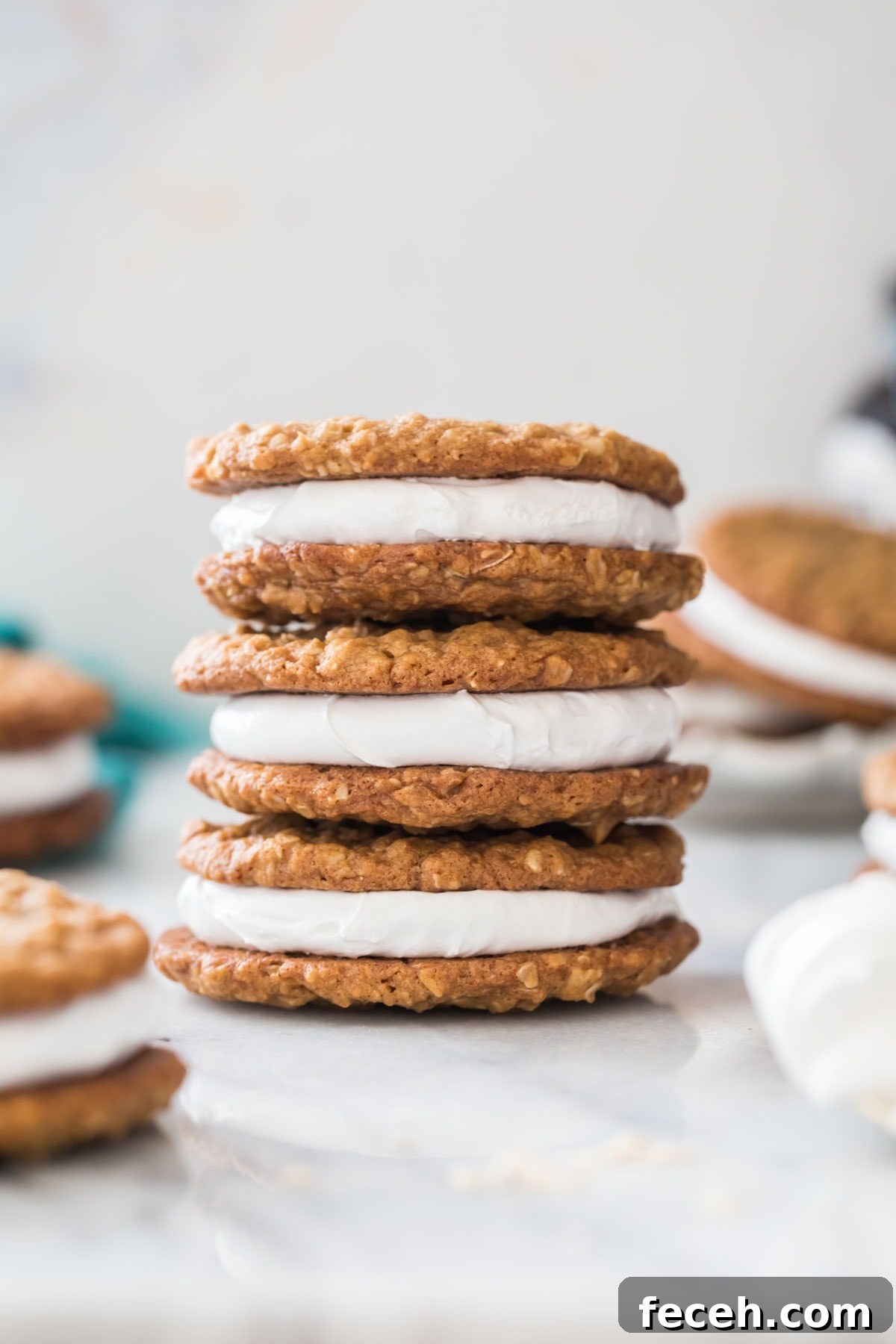 three oatmeal cream pies stacked vertically on top of each other