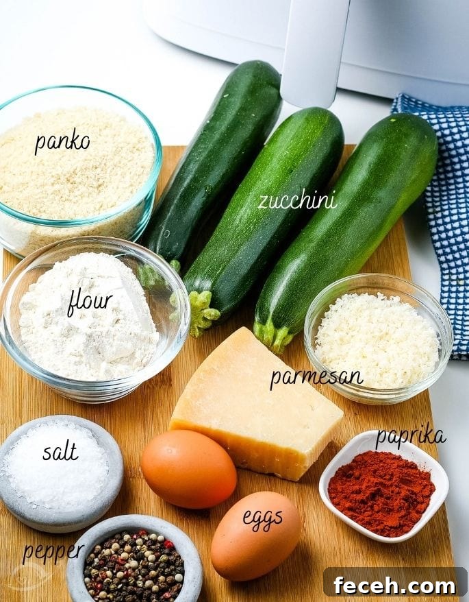 Ingredients to make crispy breaded air fryer zucchini chips with text labels.