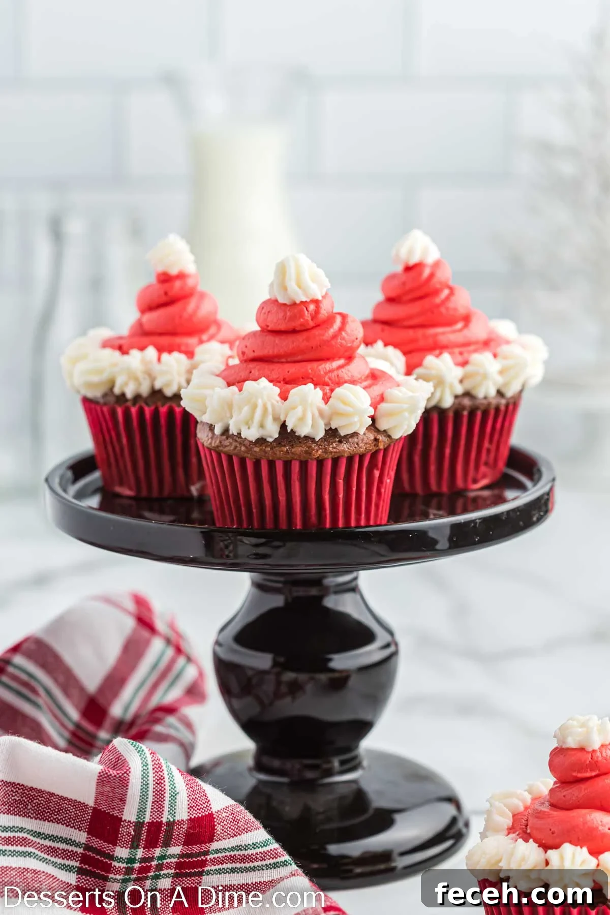Santa Hat Cupcake on a cake stand
