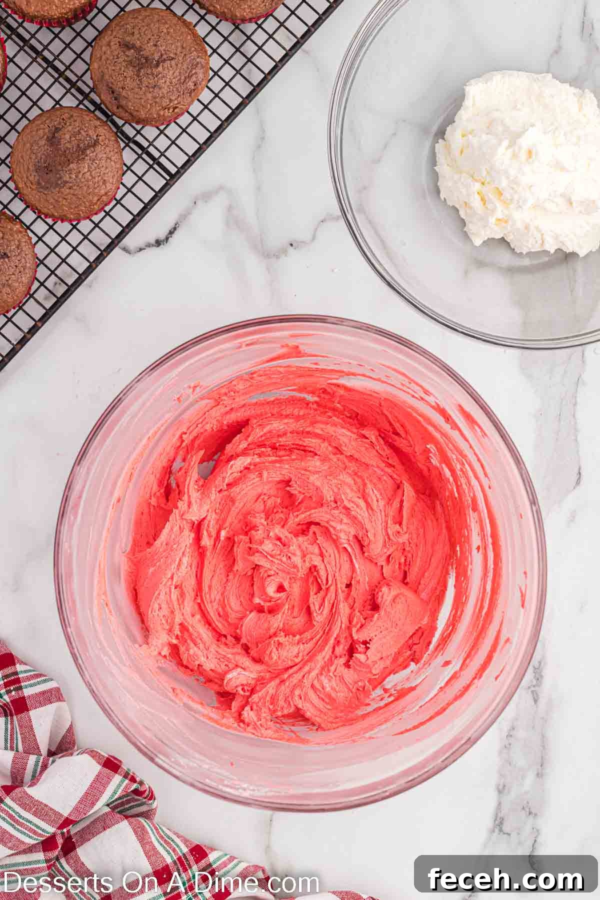 Red food coloring adding to the frosting and combined.