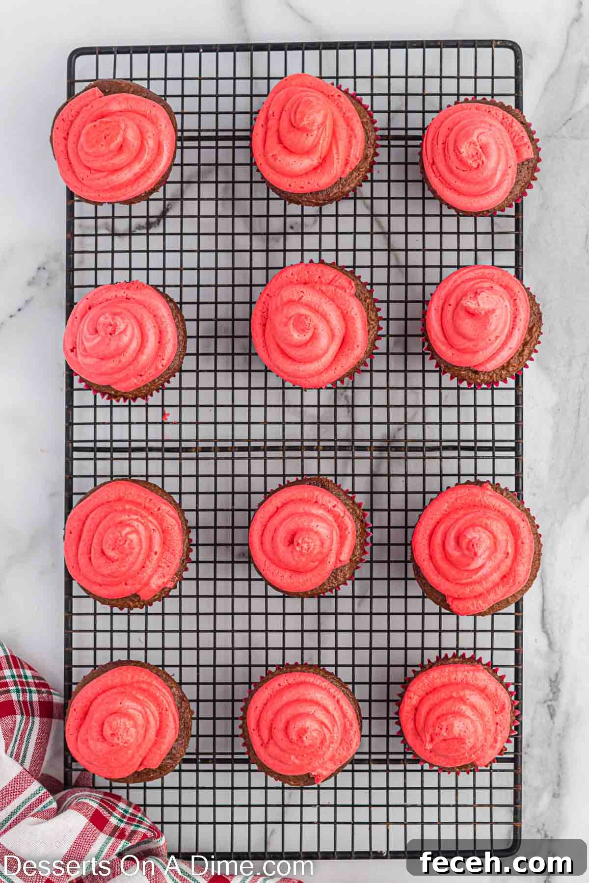 Red frosting piped on the cupcakes.