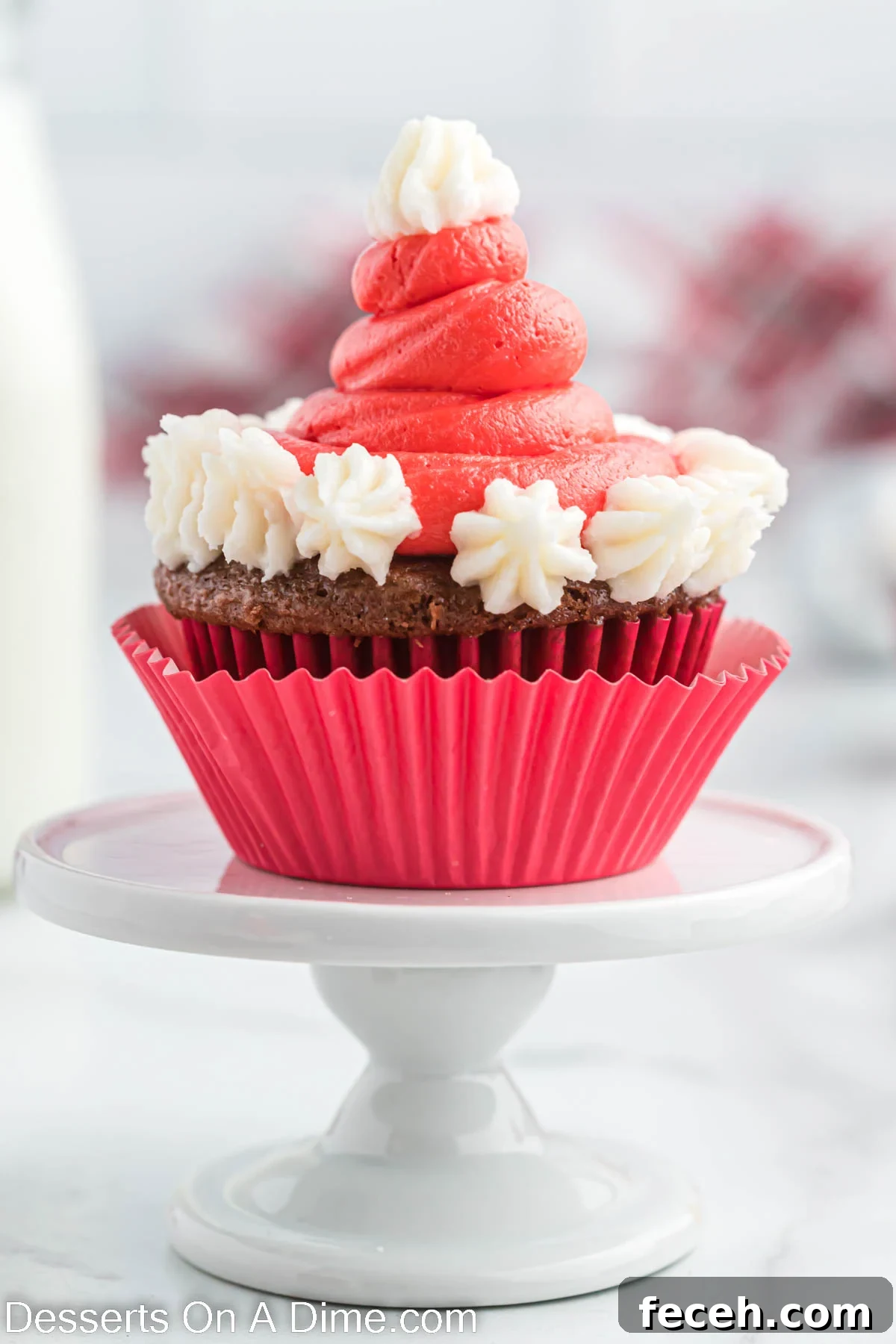 Santa Hat Cupcake on a cake stand