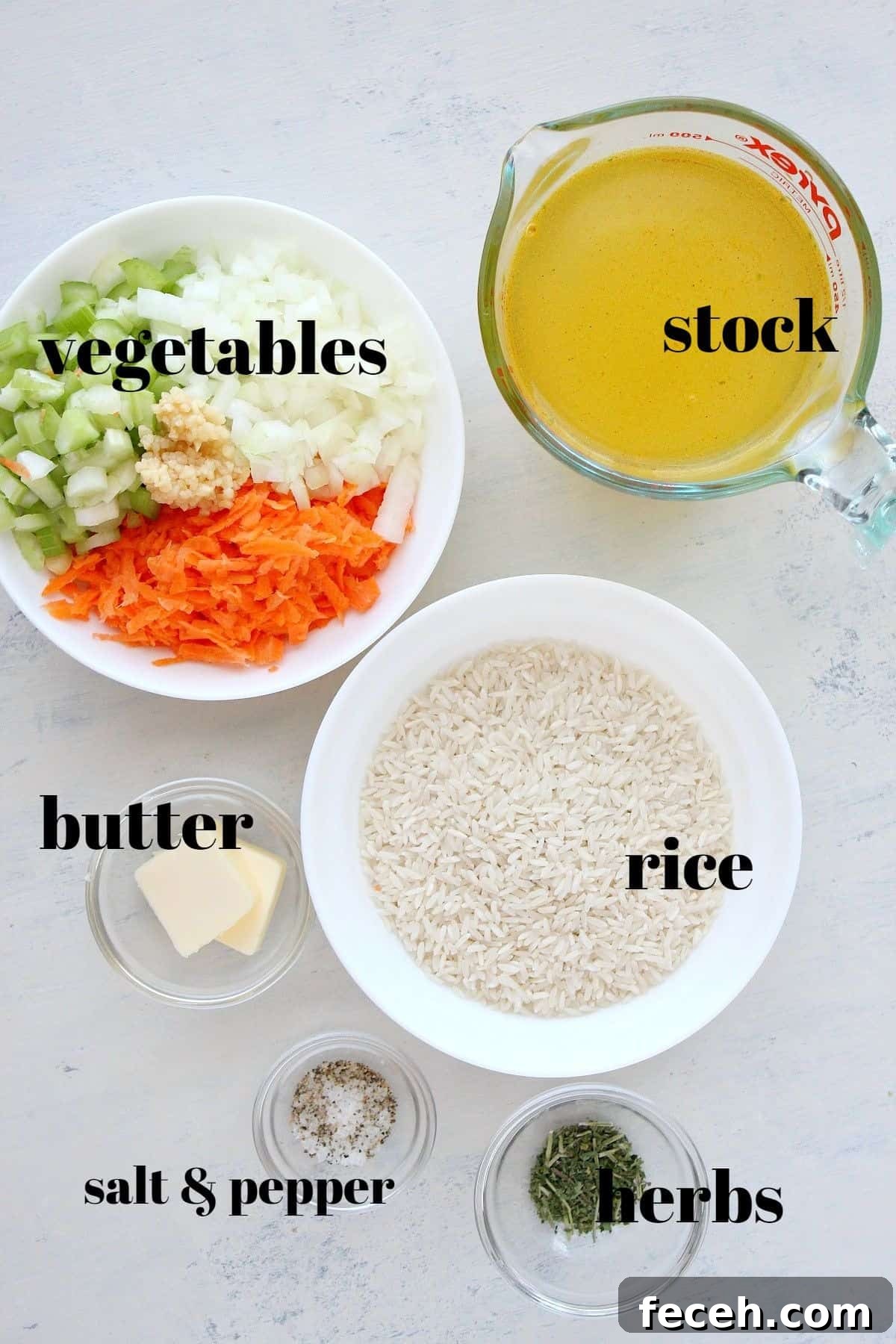 Ingredients for rice pilaf on a board.