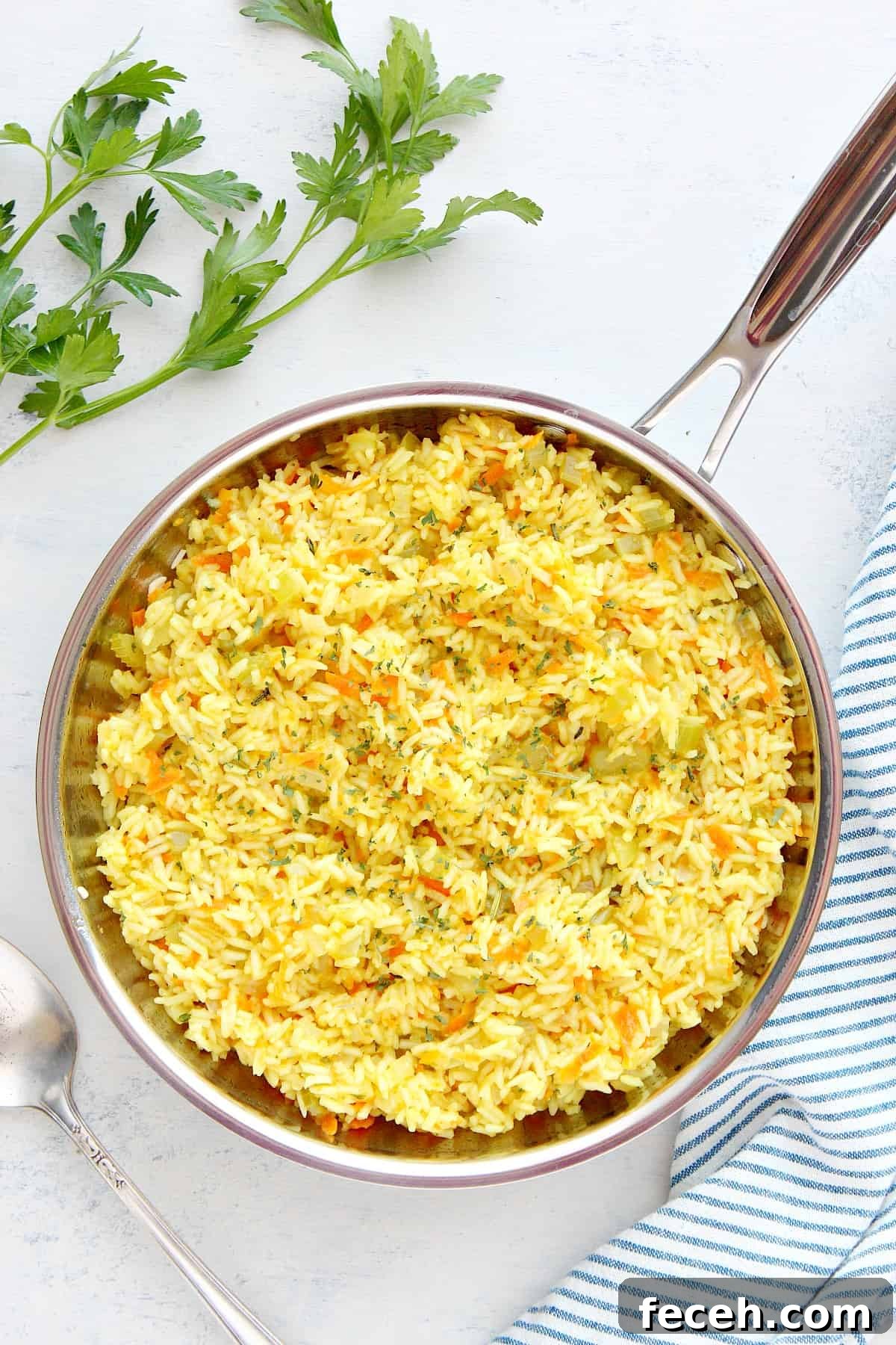 Rice dish in a stainless steel pan.