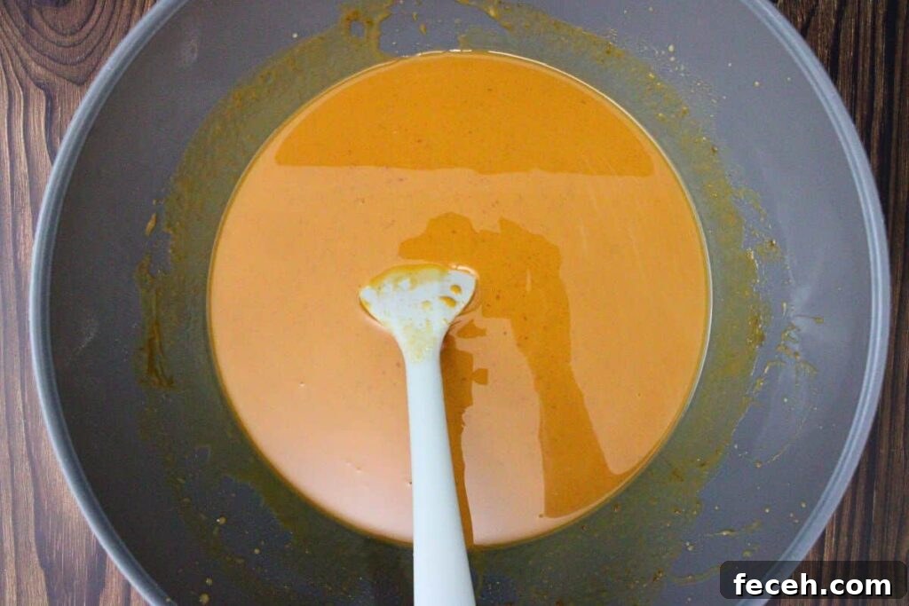 add pumpkin pudding mix, milk, vodka, rumchata, and pumpkin puree to large mixing bowl
